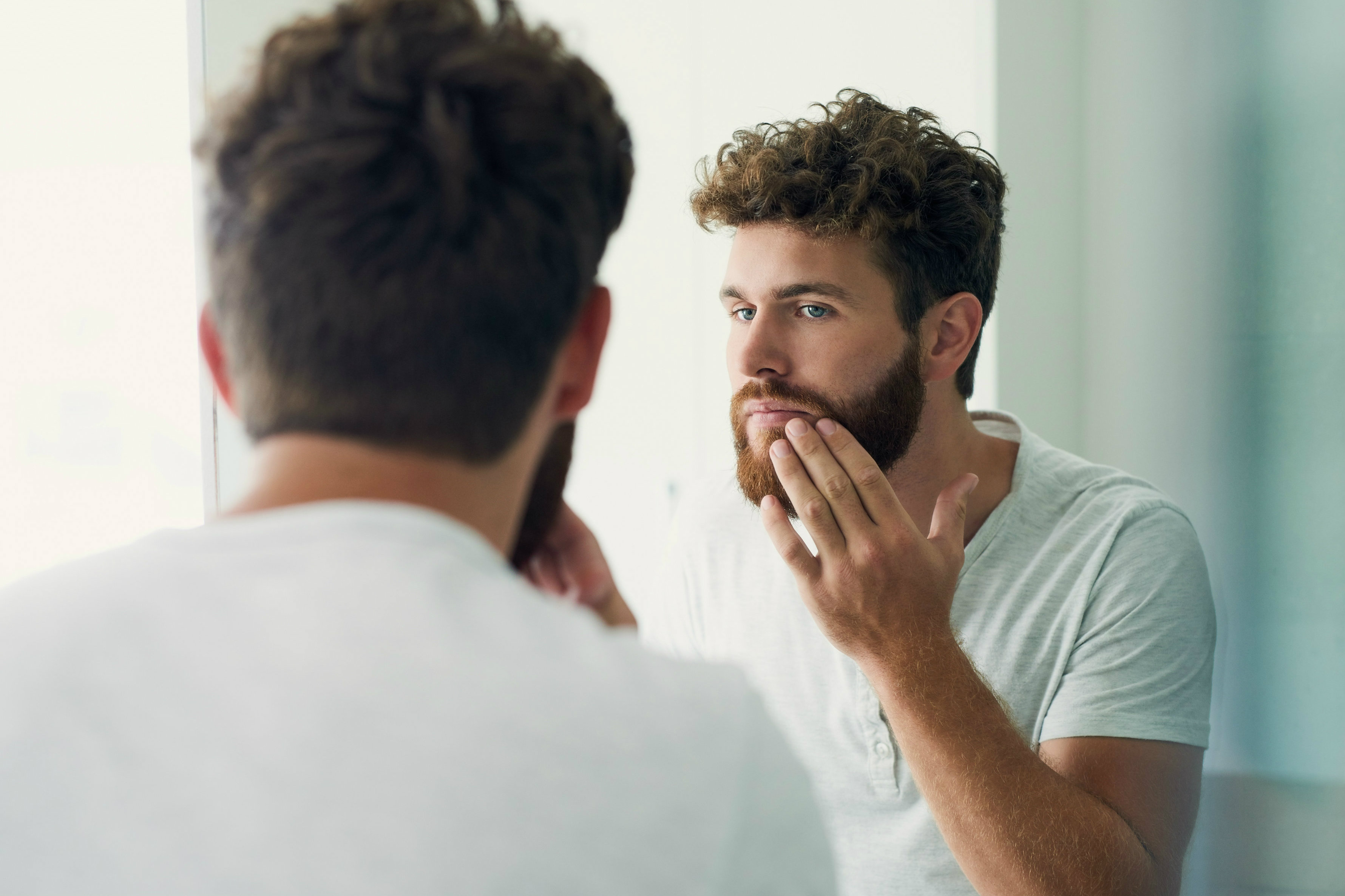 Man grooming his beard